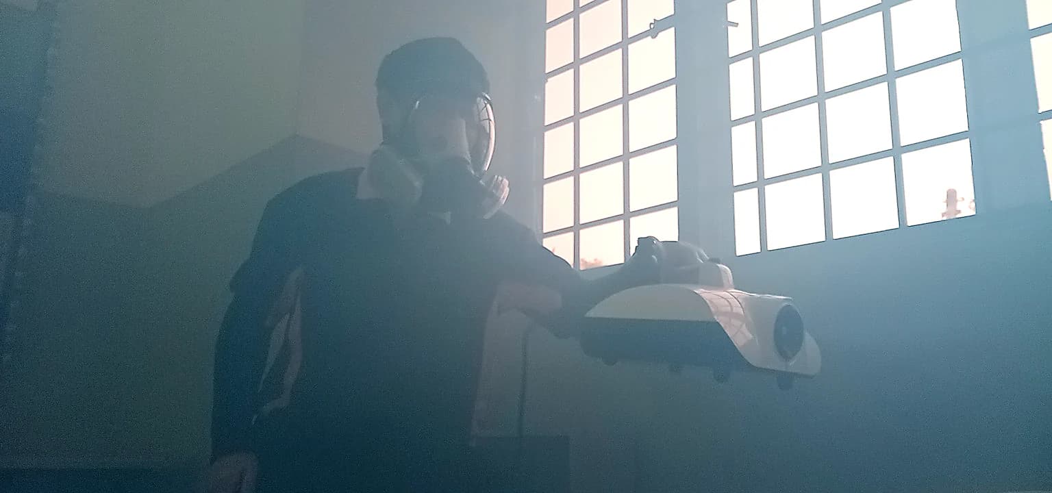 JA Hygiene technician treating an education-centre room